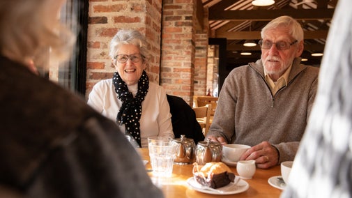 Visitors enjoying coffee and cake in the restaurant at Beningbrough